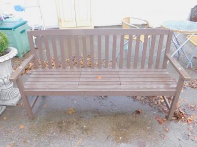 A brown painted slatted garden bench