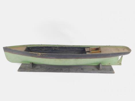 A wooden scale model of a Victorian ship hull