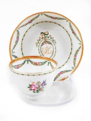 An 18thC Chinese export armorial tea bowl and saucer