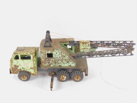 A Tinplate model of a lorry with crane attachment