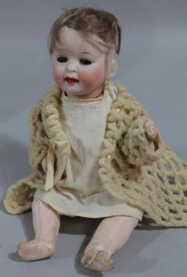 An early 20thC miniature bisque headed child's doll - 2