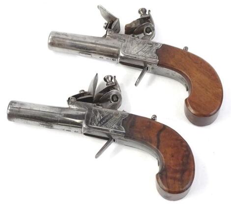 A pair of 19thC flintlock pistols