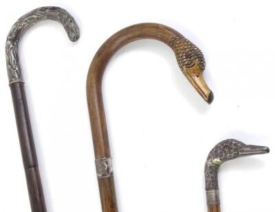 Three late 19thC/early 20thC walking canes