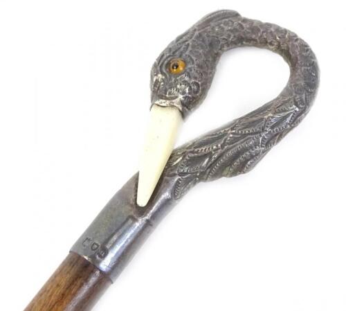 A small mahogany and silver mounted walking cane