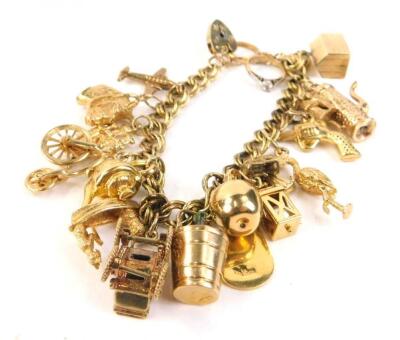 A 9ct gold and yellow metal charm bracelet
