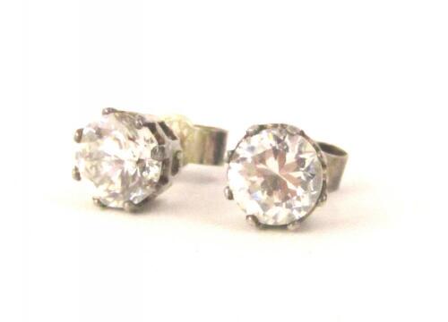 A pair of diamond stud earrings