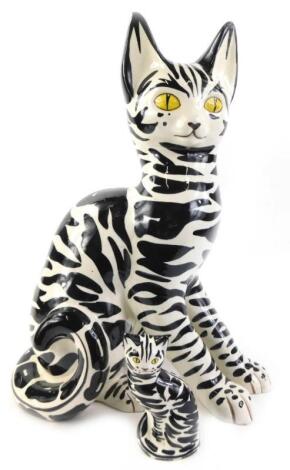 A large Italian pottery model of a black and white tabby cat