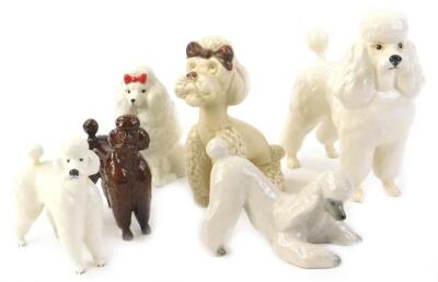 A collection of Beswick and other ceramic poodles