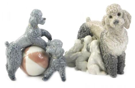 A pair of Lladro porcelain poodle groups