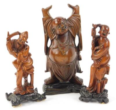 An oriental carved wooden model of buddhas