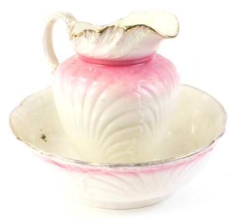 A shell moulded Victorian style wash jug and bowl