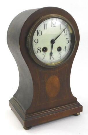 An Edwardian mahogany and simulated marquetry balloon shaped mantel clock