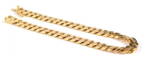 A yellow metal curb link bracelet