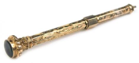 A late 19th/early 20thC yellow metal engraved propelling pencil