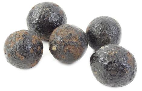 Five various 18thC and earlier iron cannonballs