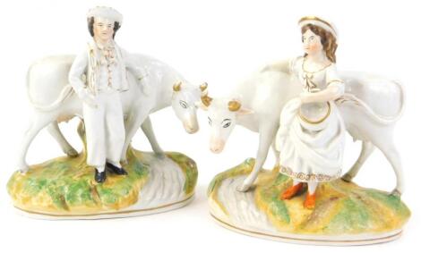 A pair of Staffordshire ceramic models of cows