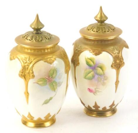 A pair of Royal Worcester pot pourri vases and covers