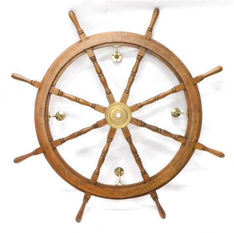 A teak decorative ships type wheel