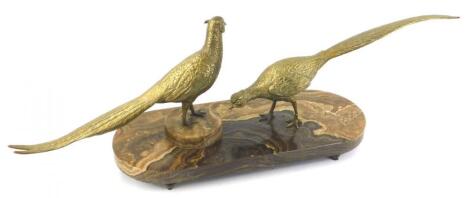 A pair of brass cock and hen pheasants