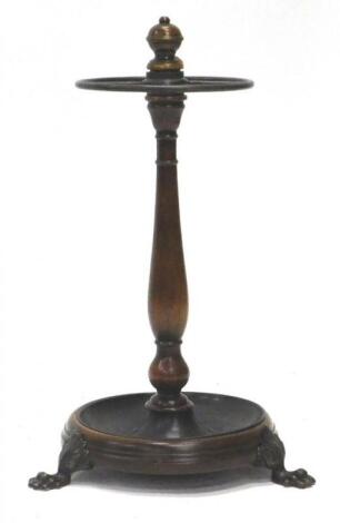 A mahogany and bronzed metal umbrella stand