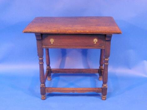 An 18thC oak side table with moulded top