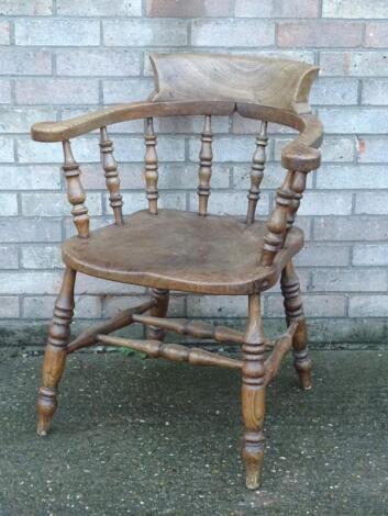 A 19thC ash and elm captain's chair