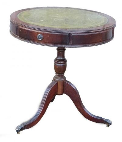 A reproduction mahogany small drum table