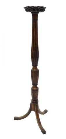 A mahogany torchere