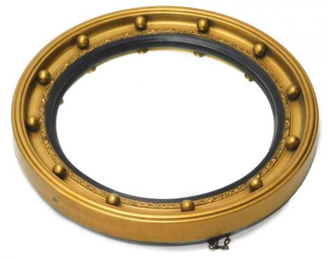 A Regency style gilt convex wall mirror