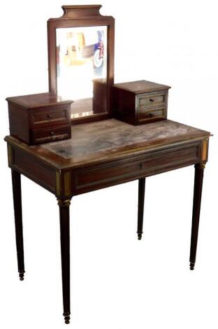 A French mahogany and brass inlaid dressing table