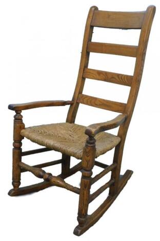 A 19thC ash ladderback rocking chair