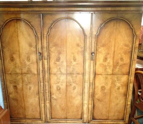 A walnut triple wardrobe