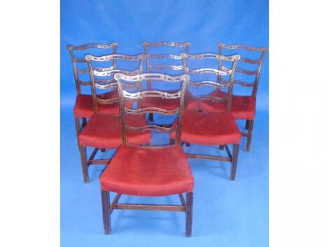 A set of six Chippendale pierced ladder back design dining chairs