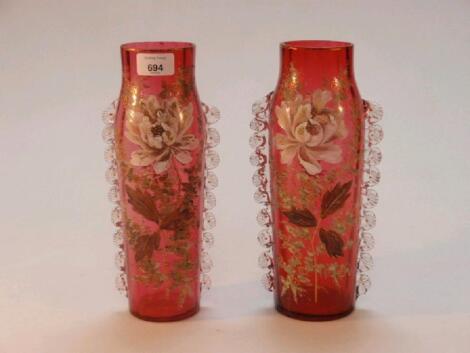 A pair of Victorian cranberry glass vases