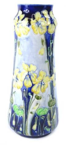 A Macintyre Moorcroft Florian ware vase, decorated with a design of yellow violets, hand written mark and printed mark in brown to underside, 30cm H.