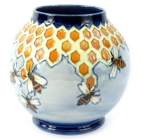 A Moorcroft Honeycomb pattern vase, designed by Philip Richardson, with tube lining by Lillian Leese (Johnson), the paintress Gwyneth Hebbit, 17cm H.