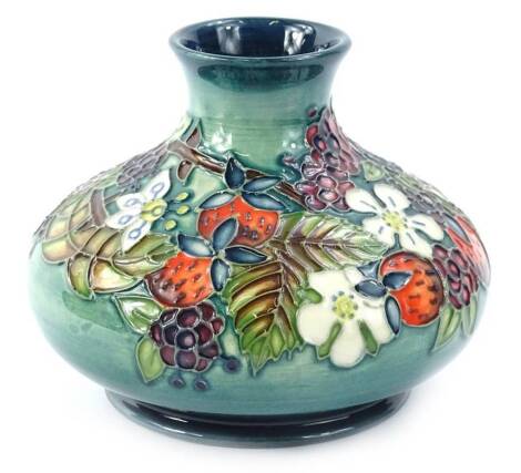 A Moorcroft centenary year carousel range vase, decorated with wild strawberry and blackberry, numbered 226, designed by Rachel Bishop with tube lining by Catherine Beech and paintress Sue Poynton, 13cm diameter.