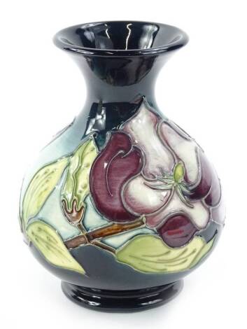 A Moorcroft Magnolia pattern vase, designed by Walter Moorcroft, the tube lining by Catherine Beech and paintress Sylvia Abell, 15cm H.