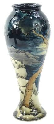 A Moorcroft trial vase, decorated with a coastal scene with trees etc., signed by Anji Davenport, dated 25.11.00, 28cm H.