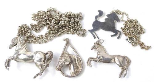 Various silver horse pendants and chains, to include a silver galloping horse pendant, 5.2g all in, a horses head in horse shoe surround, 3.2g, a silver horse pendant and chain, the galloping horse makers mark HG, 29.4g, and a modern silver horse pendant