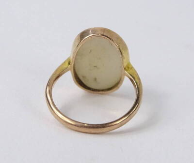 A 9ct gold cameo set dress ring, the oval cameo set with lady looking right, with hair piece, in moulded frame, 2.7g all in. - 2