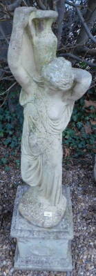 A compositions garden statue, modelled in the form of a neoclassical maiden carrying a water vessel, on a plinth, 132cm H.