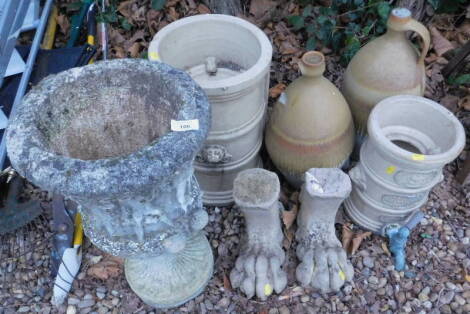 Various garden items, to include a pair of cast paw feet, a neoclassical urn, two water filters, etc.