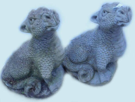 Two similar composition dragon shaped garden ornaments, 48cm H.