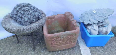 Various garden ornaments etc., to include a terracotta coloured square planter, green men masks, etc.