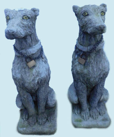 A pair of cast heraldic type dogs, with later painting etc. on a square base, 75cm H.