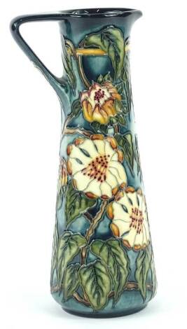 A Moorcroft pottery ewer, decorated overall with flowers by K Goodwin, limited edition number 22 of 400, handwritten and impressed marks to underside, 24cm H.