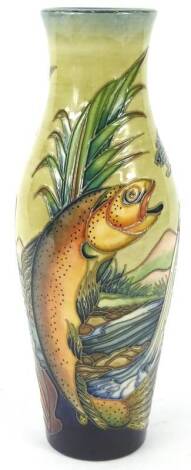 A Moorcroft Trout pattern vase, designed with jumping trout in a river, on a mottled blue, green and yellow ground, designed by Philip Gibson, tube lined by Vicky Thorley, paintress Amanda Baggley, handwritten and impressed marks to underside, 25cm H.