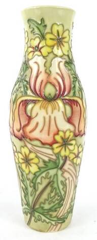 A Moorcroft flower design vase for the May 1999 Open Weekend, decorated with orchids, flowers, leaves etc ., on a cream and green ground, designed by Rachel Bishop and tube lined by Lesley Myatt, handwritten and impressed marks to underside, 25cm H., boxe