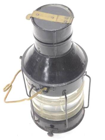 An ebonised partly brass ships lantern, with moulded lens (AF), 55cm H.